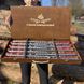 Skewers with inscriptions as a gift for a man in a wooden case