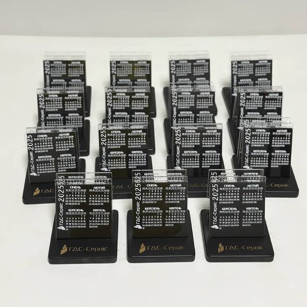 Desk calendar with acrylic inserts and company logo