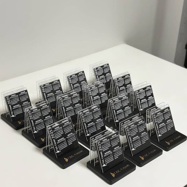 Desk calendar with acrylic inserts and company logo