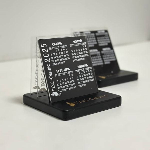 Desk calendar with acrylic inserts and company logo