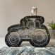 Tractor shaped piggy bank in black