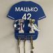 Shelf for football player's medals with name and number