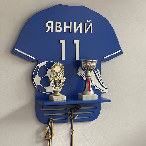 Football player's medal holder with name and number