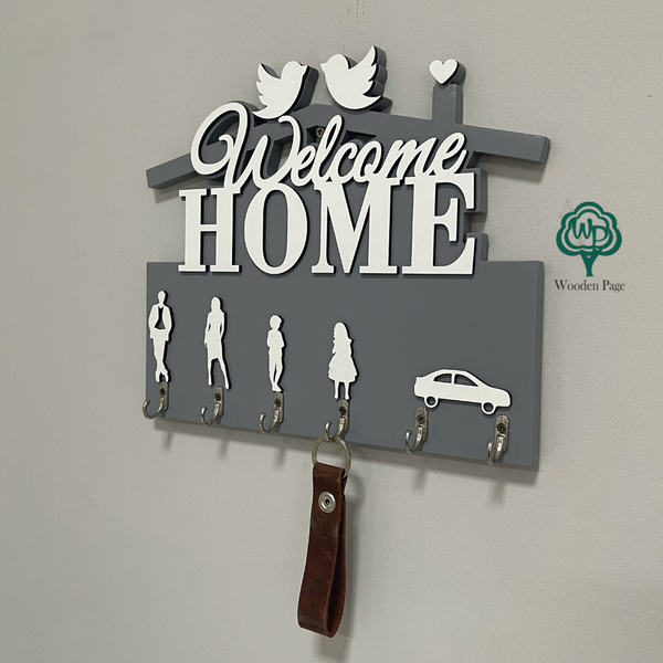 Key holder with figures in the Welcome home hallway