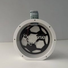 Children's piggy bank in the shape of a ball for a boy