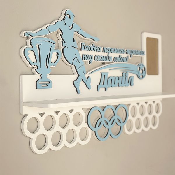 Wooden medal holder for a football player with a phrase