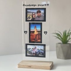 Photo frame with printed photos on a stand for 3 photos
