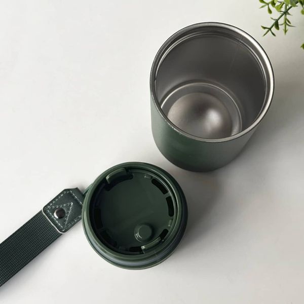 Green thermo mug as a gift for a soldier