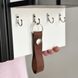 Miniature designer key holder for the wall