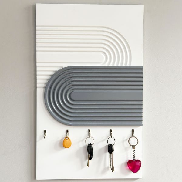 Designer textured key holder for the escutcheon