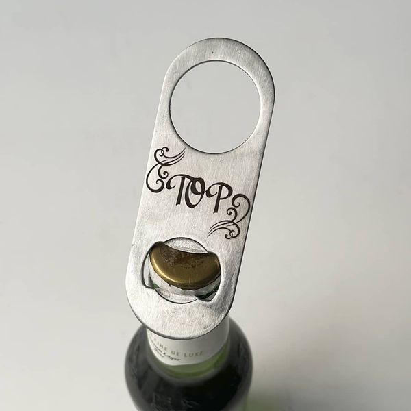 Metal bottle opener with engraving