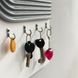 Designer textured key holder for the escutcheon