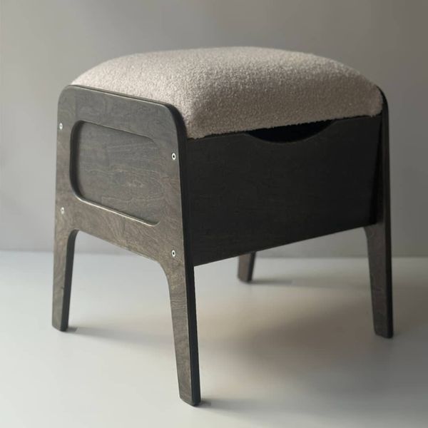 A shoe ottoman with a drawer for small items