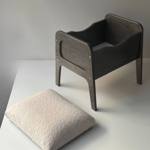 A shoe ottoman with a drawer for small items