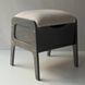 A shoe ottoman with a drawer for small items