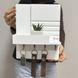Designer mini key holder in white with logo
