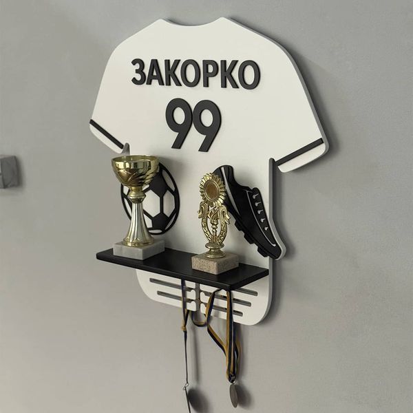 A shelf for awards and medals for a football player
