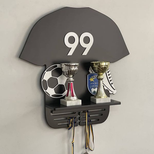 Shelf for cups and medals for a football player as a gift