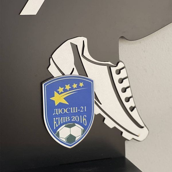 Shelf for cups and medals for a football player as a gift