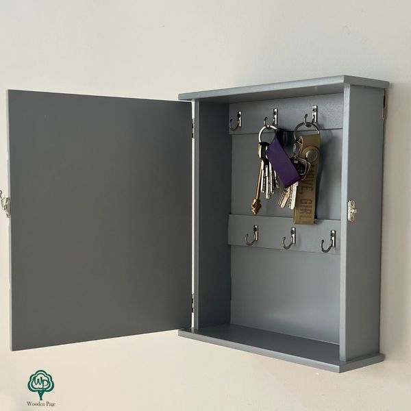 Designer wooden key holder with door