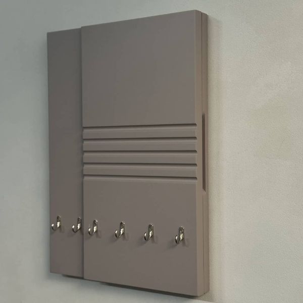 Designer key holder for a shield in mocha color