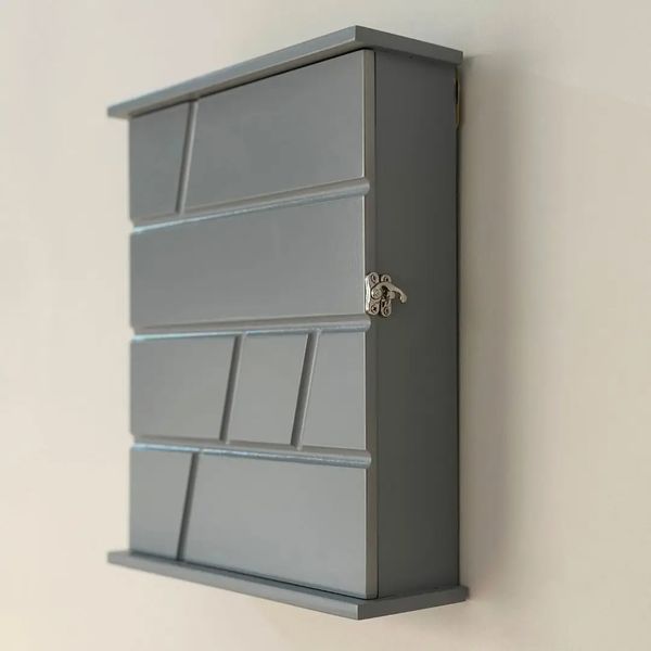 Designer wooden key holder with door