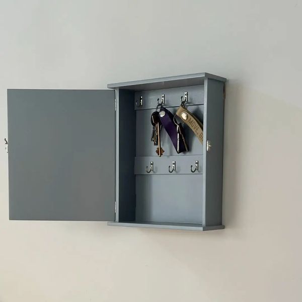 Designer wooden key holder with door