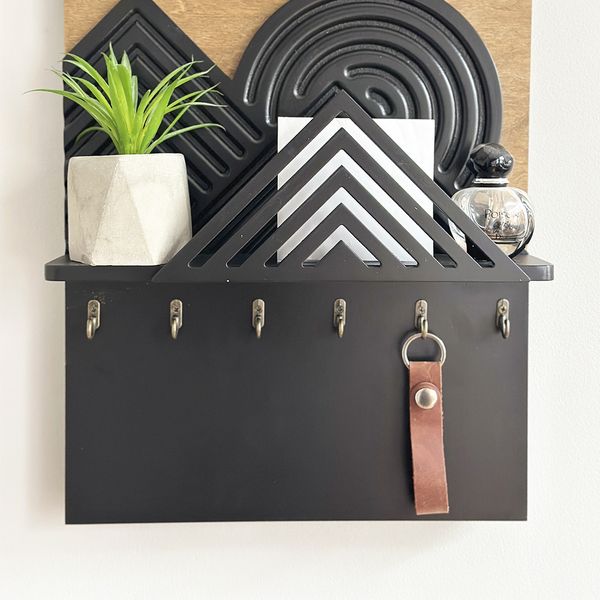 Designer key holder with a shelf on the shield