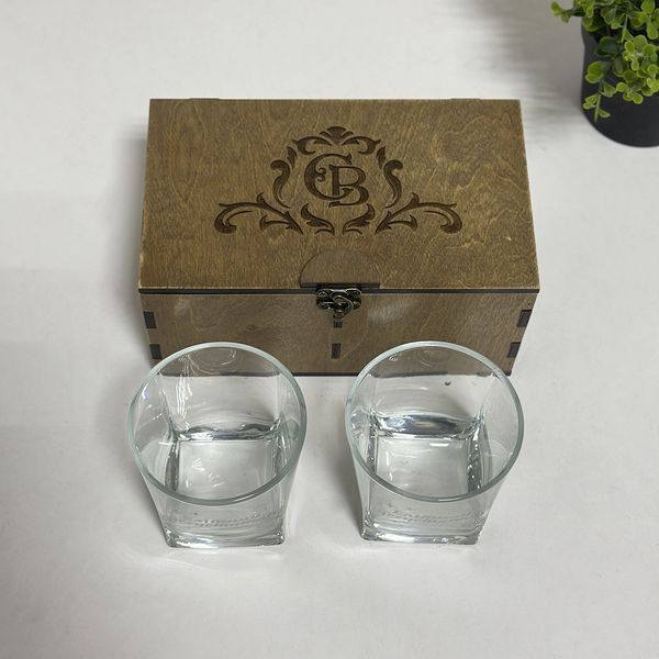 Gift set of whiskey glasses with engraving in a wooden box