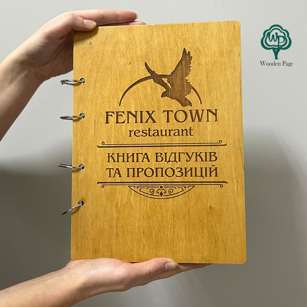Book of reviews and suggestions in a wooden cover