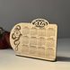 Desk calendar for 2025 with snake and logo