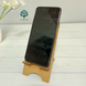Wooden phone stand as a gift for a girl