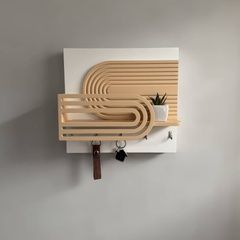 Wall-mounted key holder for a panel in two colors