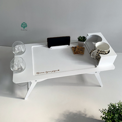 Folding table with engraving in white