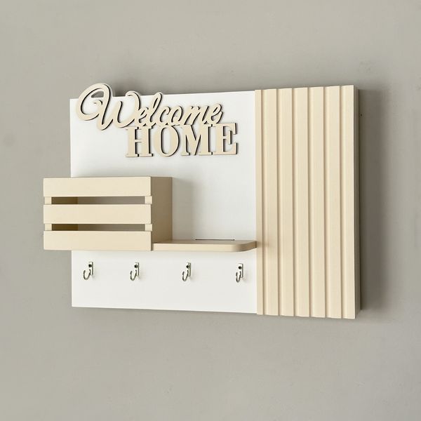 Designer key holder on the shield in beige color