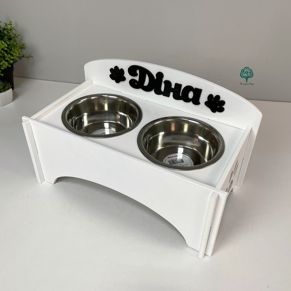 Bowls on a stand with the name of the dog Fred