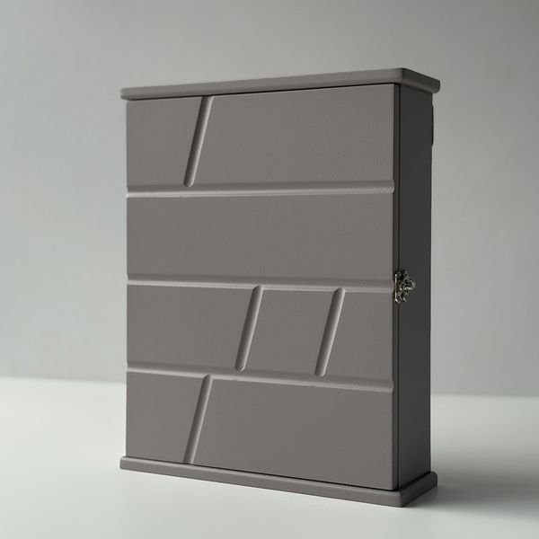 Designer key holder with a door