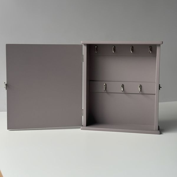 Designer key holder with a door