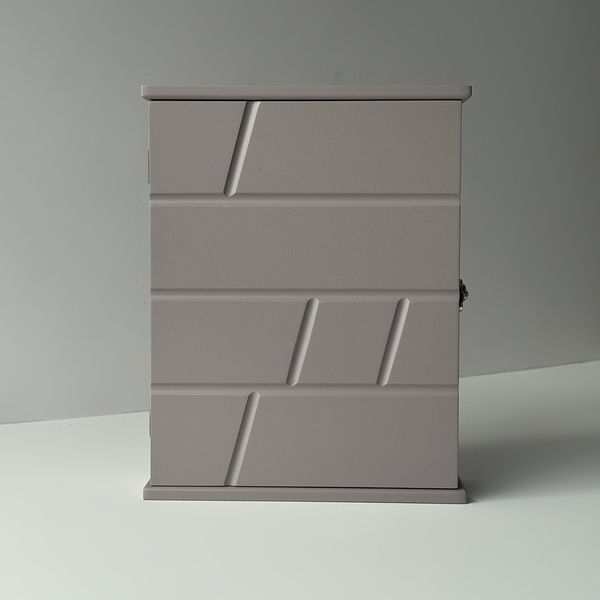 Designer key holder with a door
