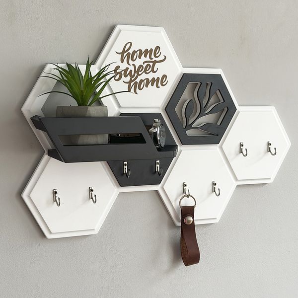 Designer key holder in the shape of a honeycomb