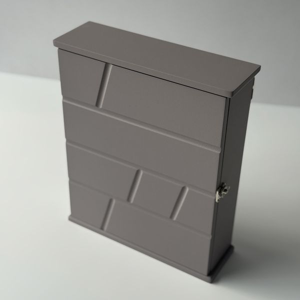 Designer key holder with a door