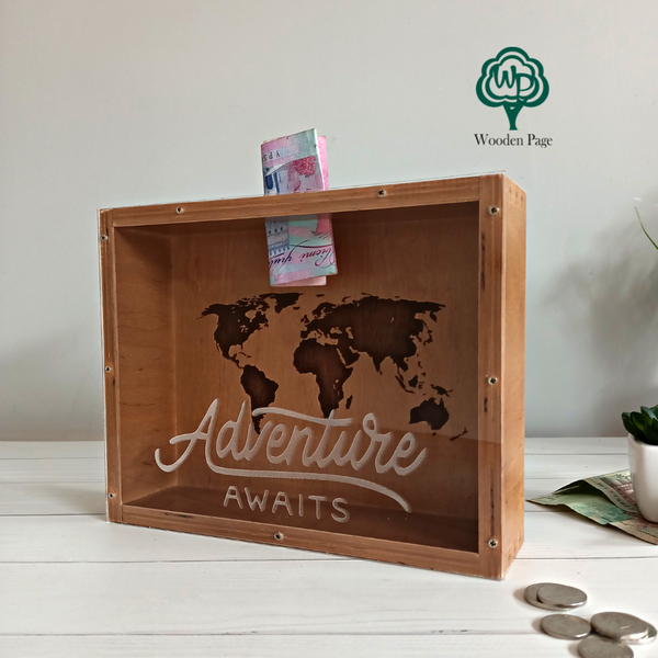 Money box with "Adventure awaits" engraving