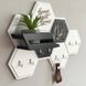 Designer key holder in the shape of a honeycomb