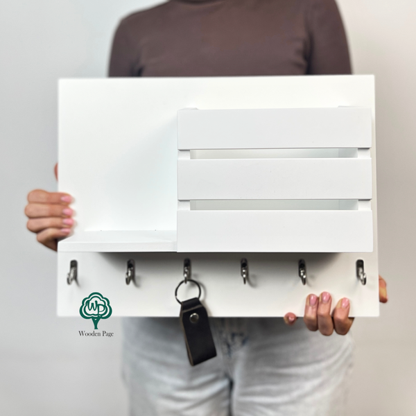 Wall-mounted key holder with shelf and pocket