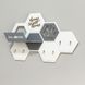 Designer key holder with a honeycomb-shaped shelf