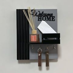 Designer key holder for a shield and intercom in gray and black tones