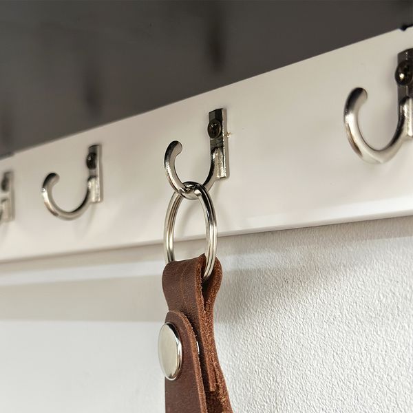 Designer key holder with shelf in art deco style