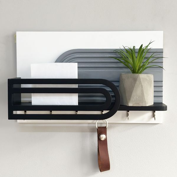 Designer key holder with shelf in art deco style