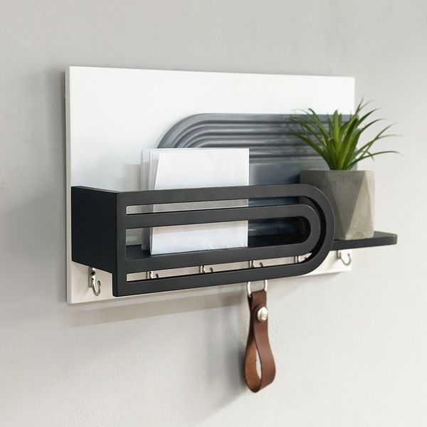 Designer key holder with shelf in art deco style