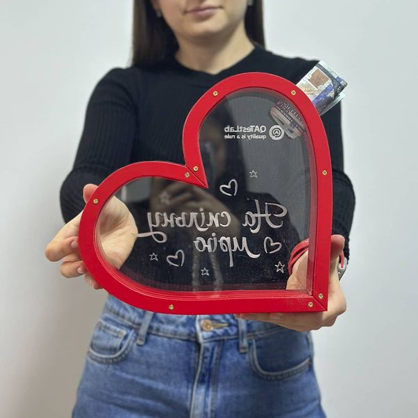 Heart-shaped money box "For a common dream" with logo